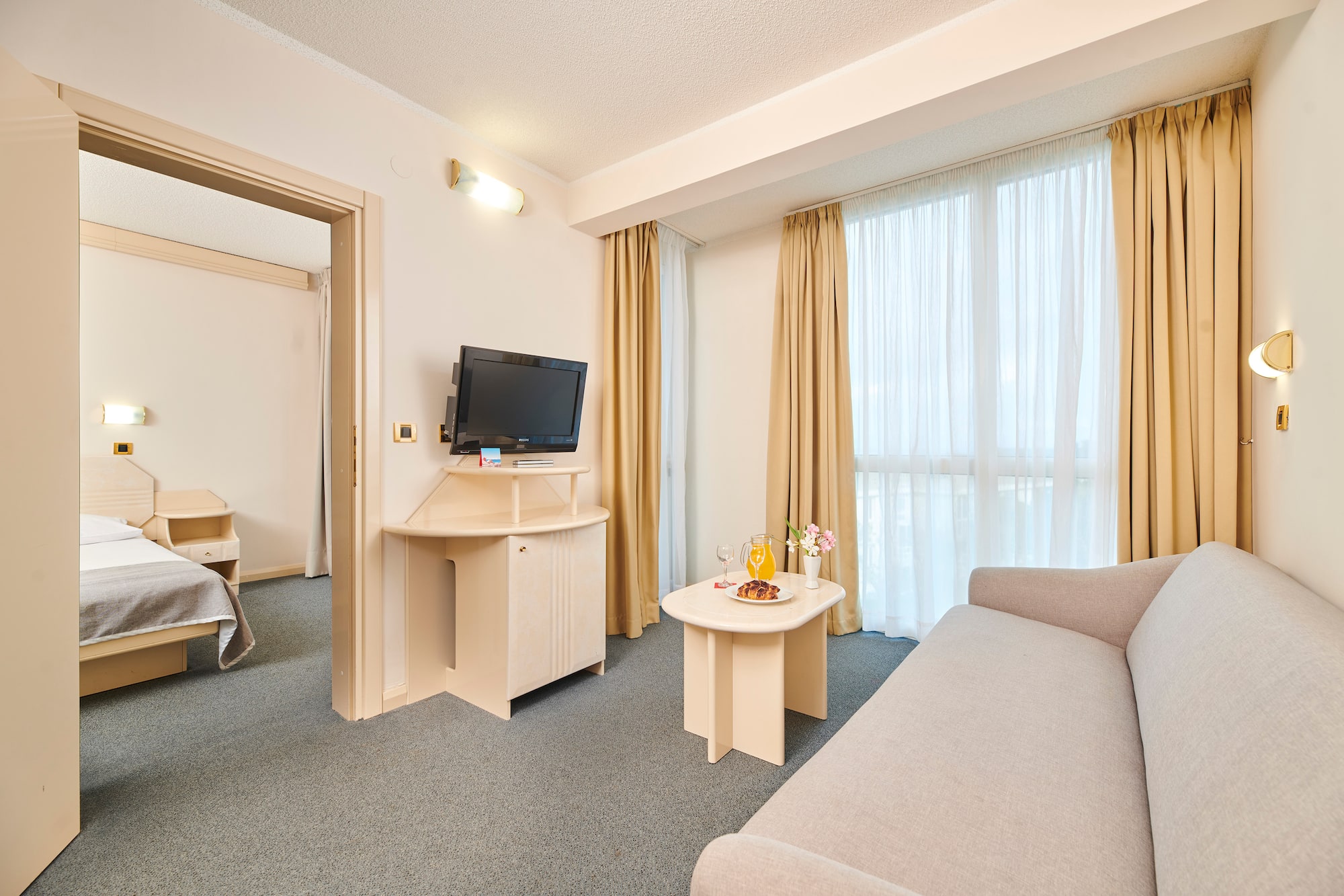 a room with a television and a couch