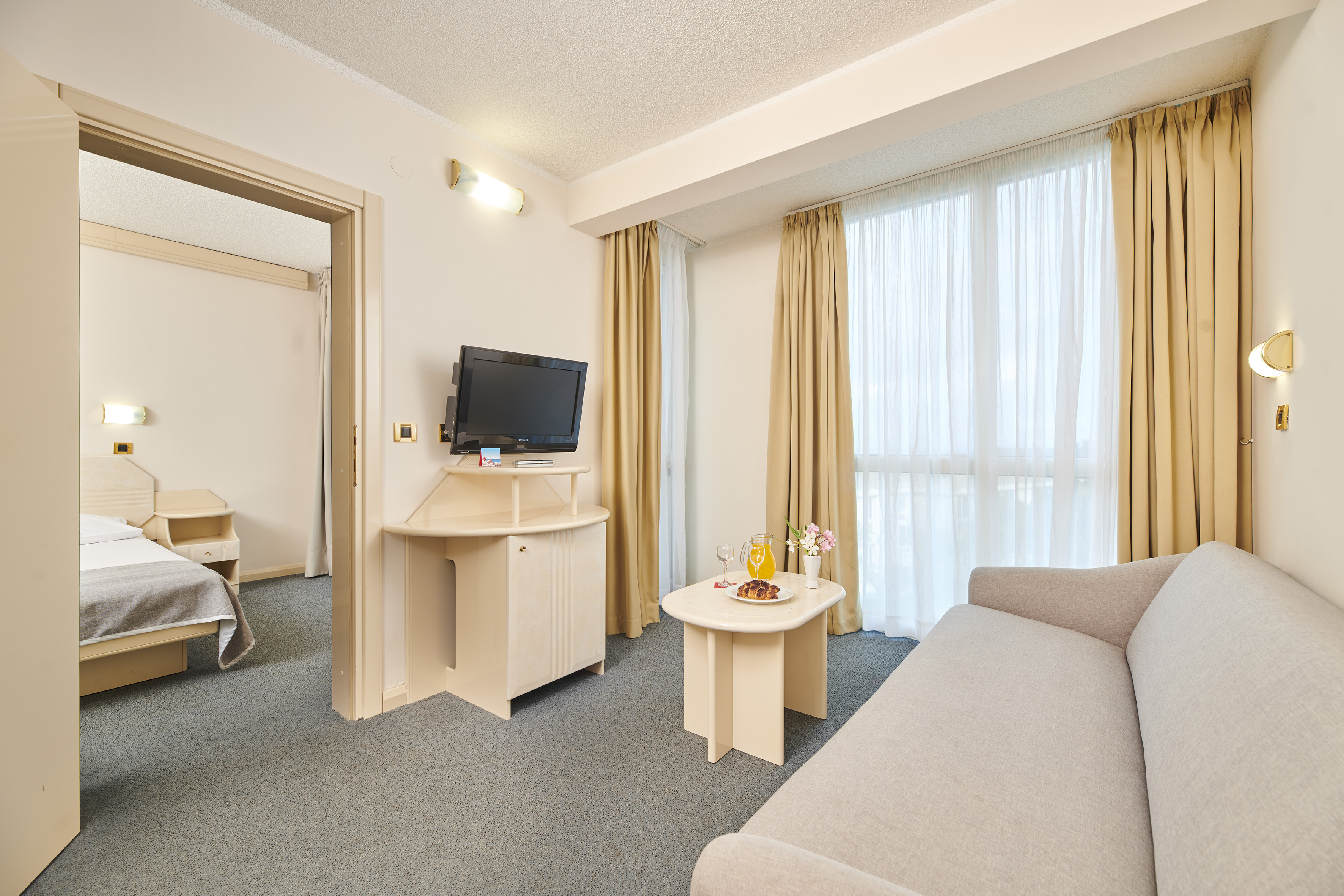 a room with a television and a couch