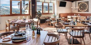 a restaurant with tables and chairs