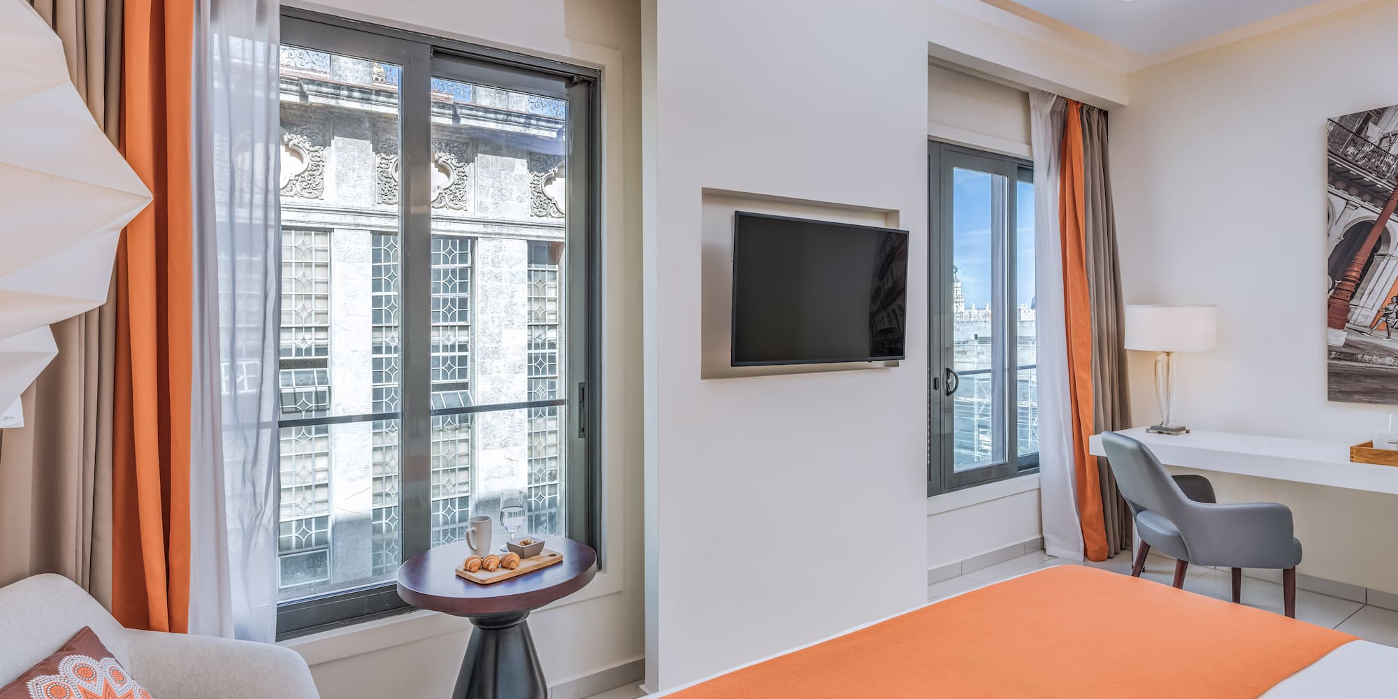 a room with a bed and a tv