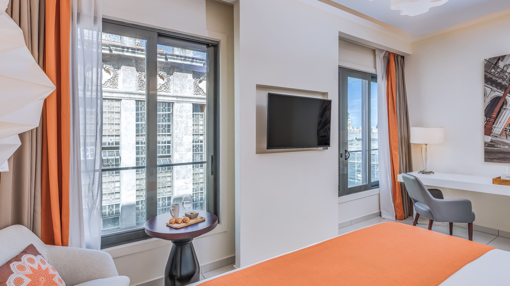 a room with a bed and a tv