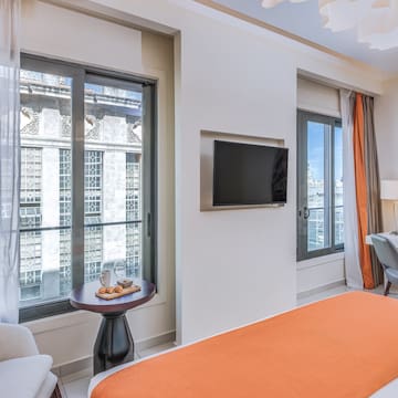 a room with a bed and a tv