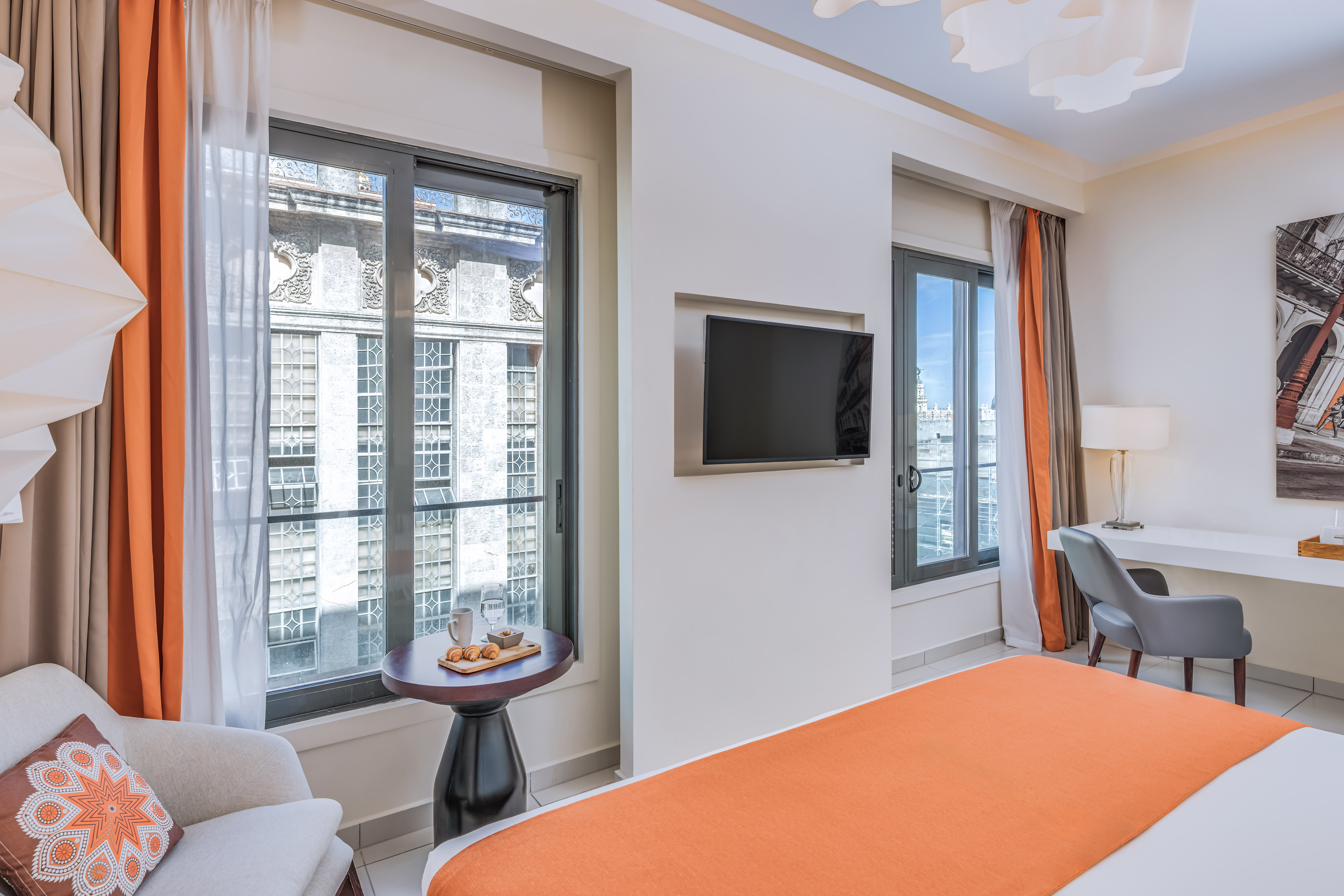 a room with a bed and a tv