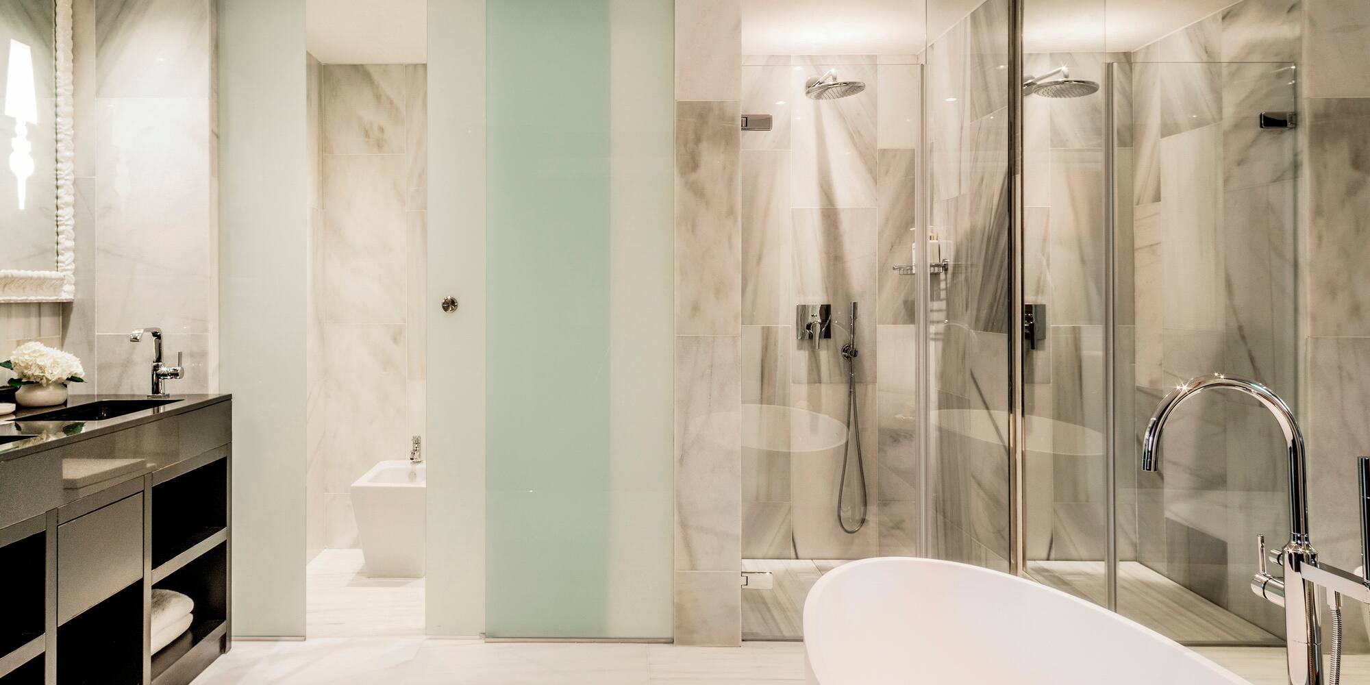 a bathroom with a tub and shower