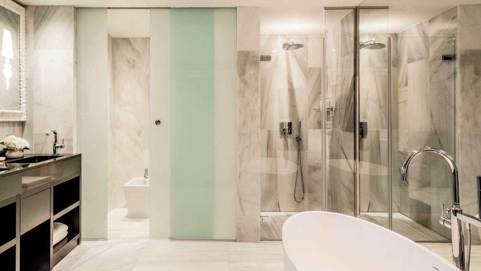 a bathroom with a tub and shower