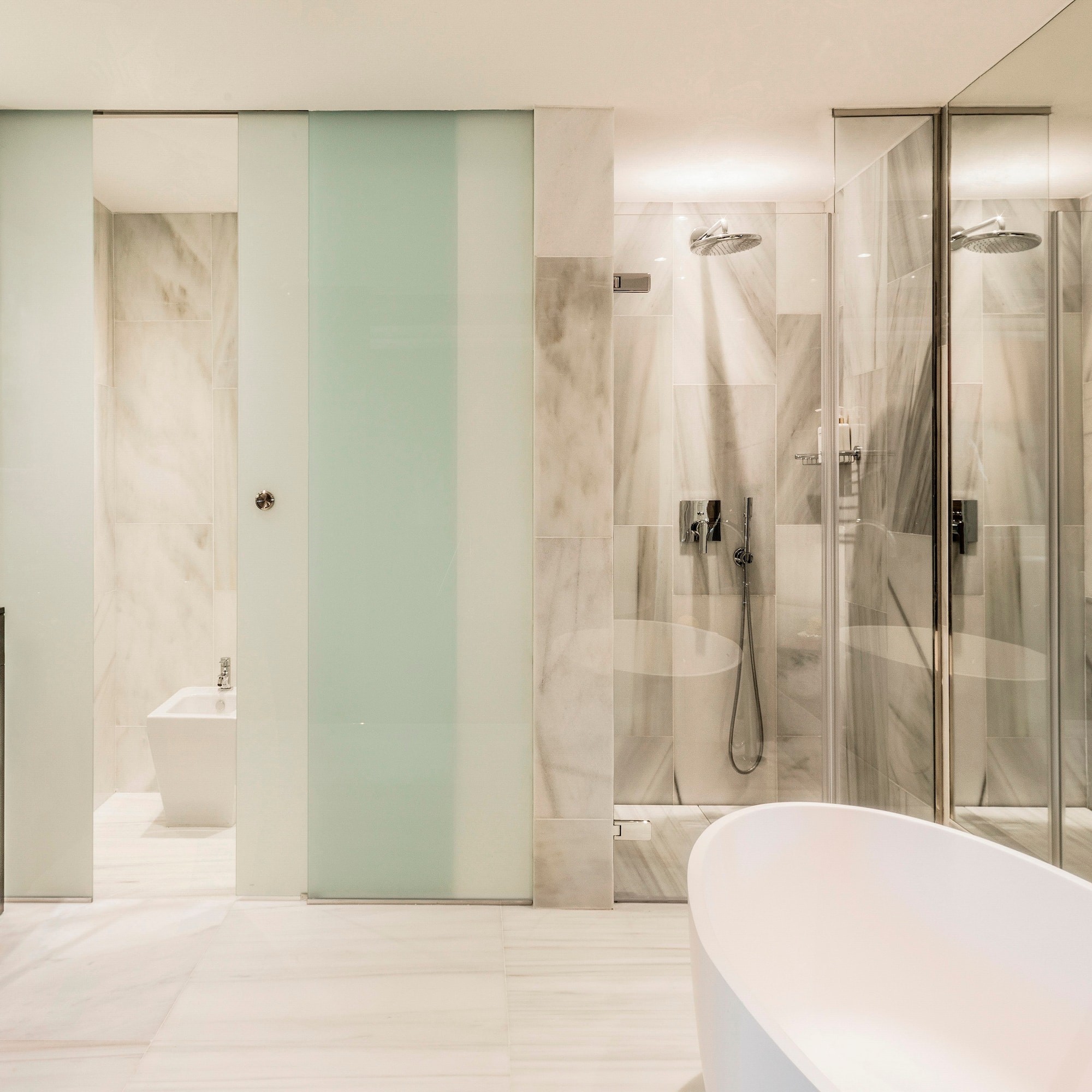 a bathroom with a tub and shower