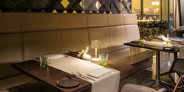 a table with a white tablecloth and silverware on it