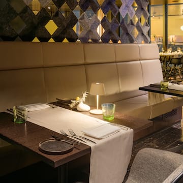 a table with a white tablecloth and silverware on it