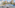 a balcony with a pool and chairs
