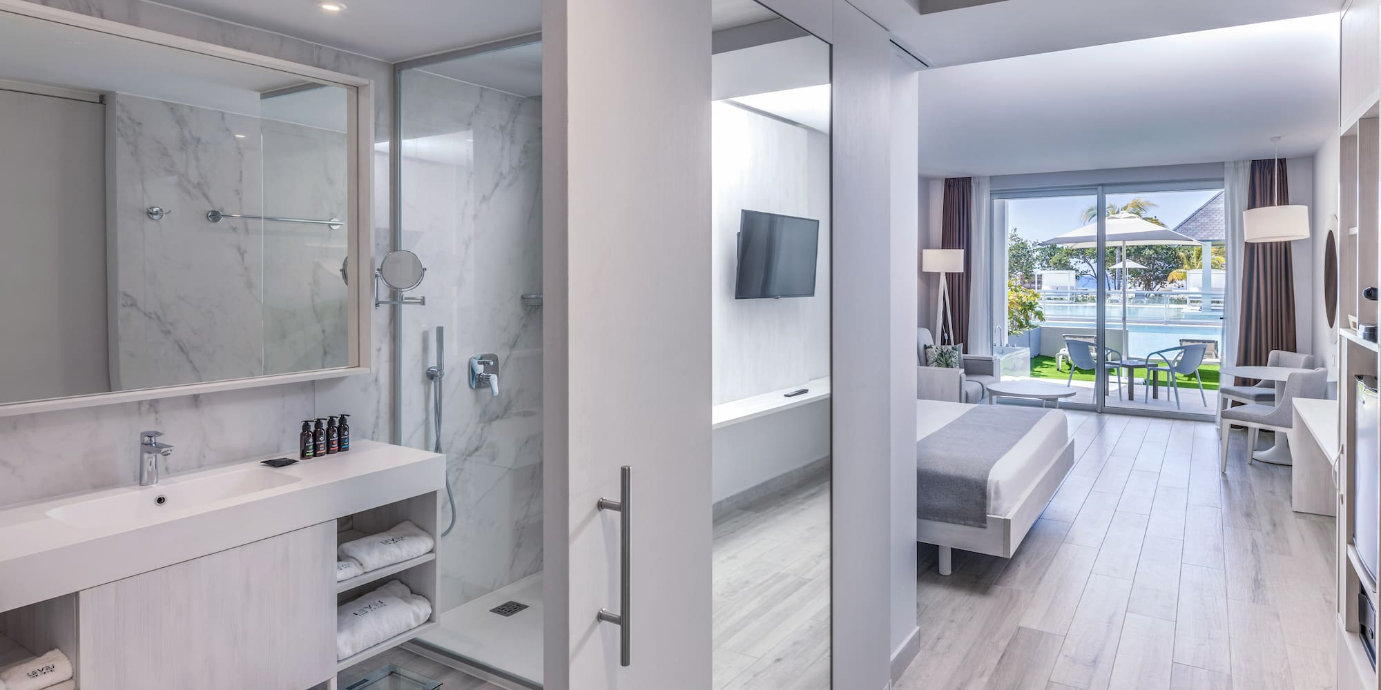 a bathroom with a mirror and a shower