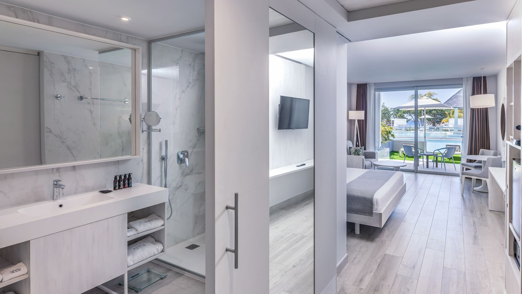 a bathroom with a mirror and a shower