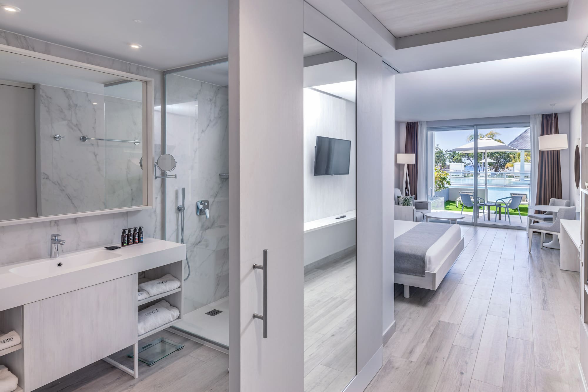 a bathroom with a mirror and a shower
