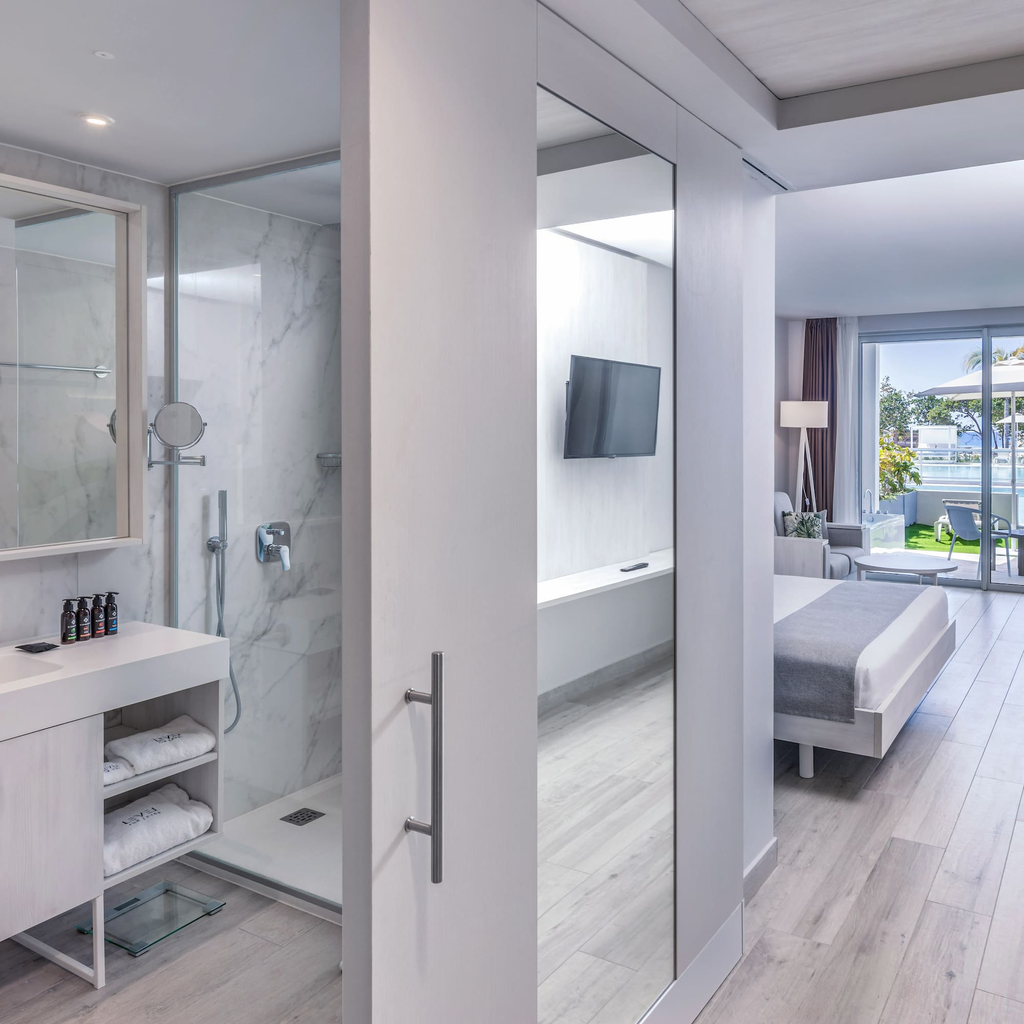 a bathroom with a mirror and a shower