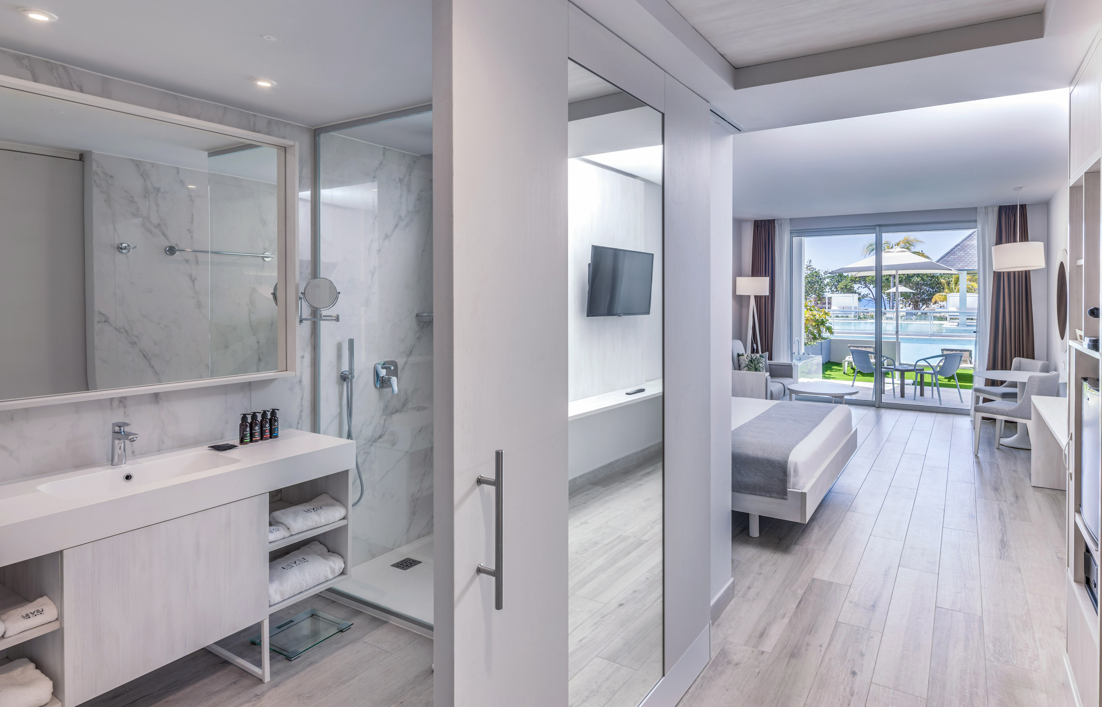 a bathroom with a mirror and a shower