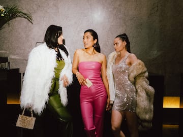 a group of women in dresses