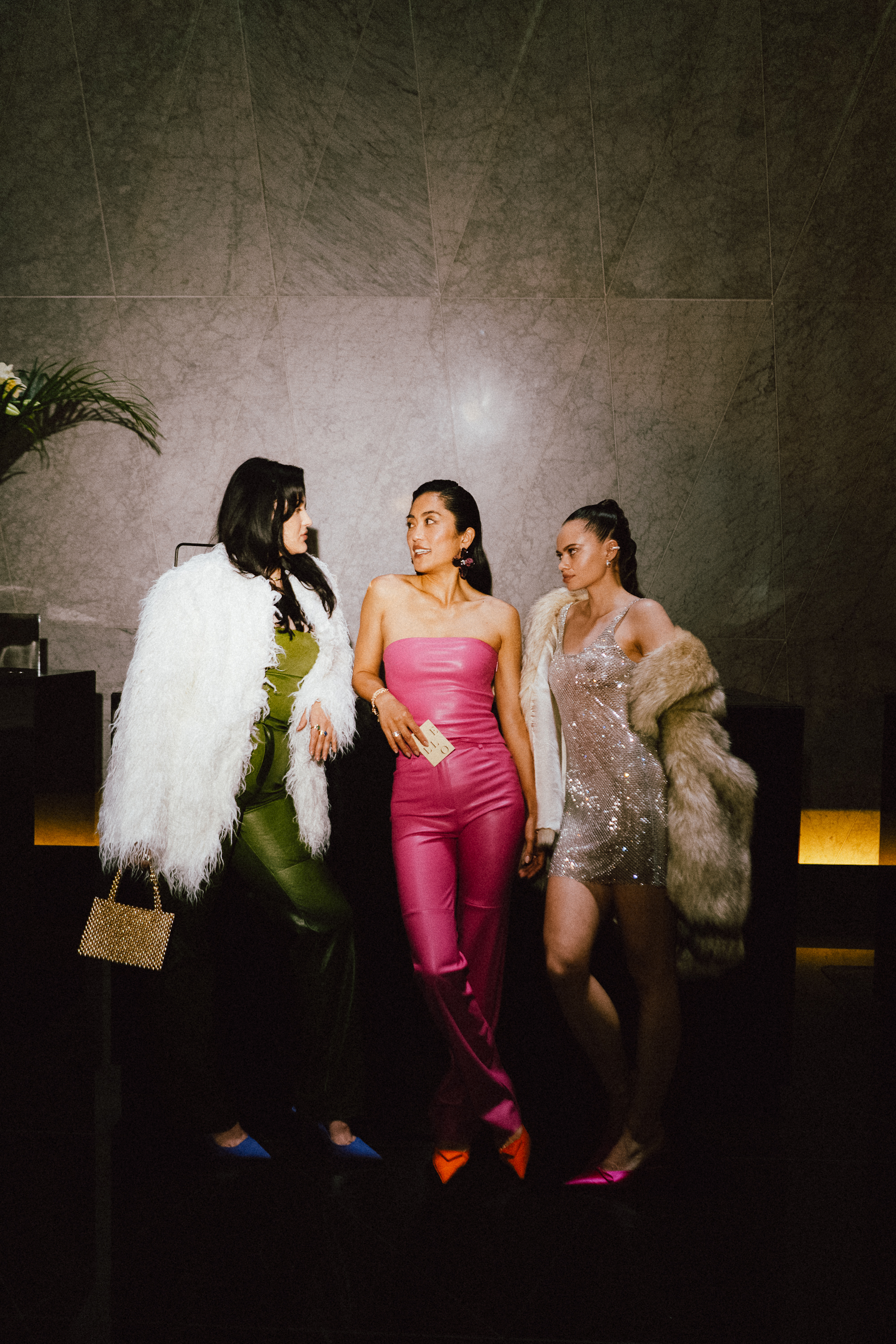 a group of women in dresses