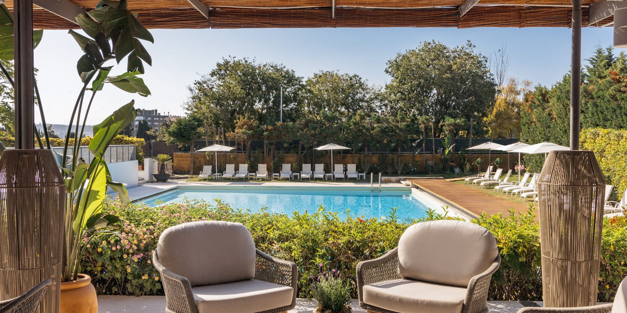 a pool with chairs and a table