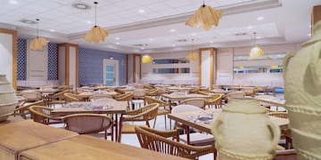 a room with tables and chairs