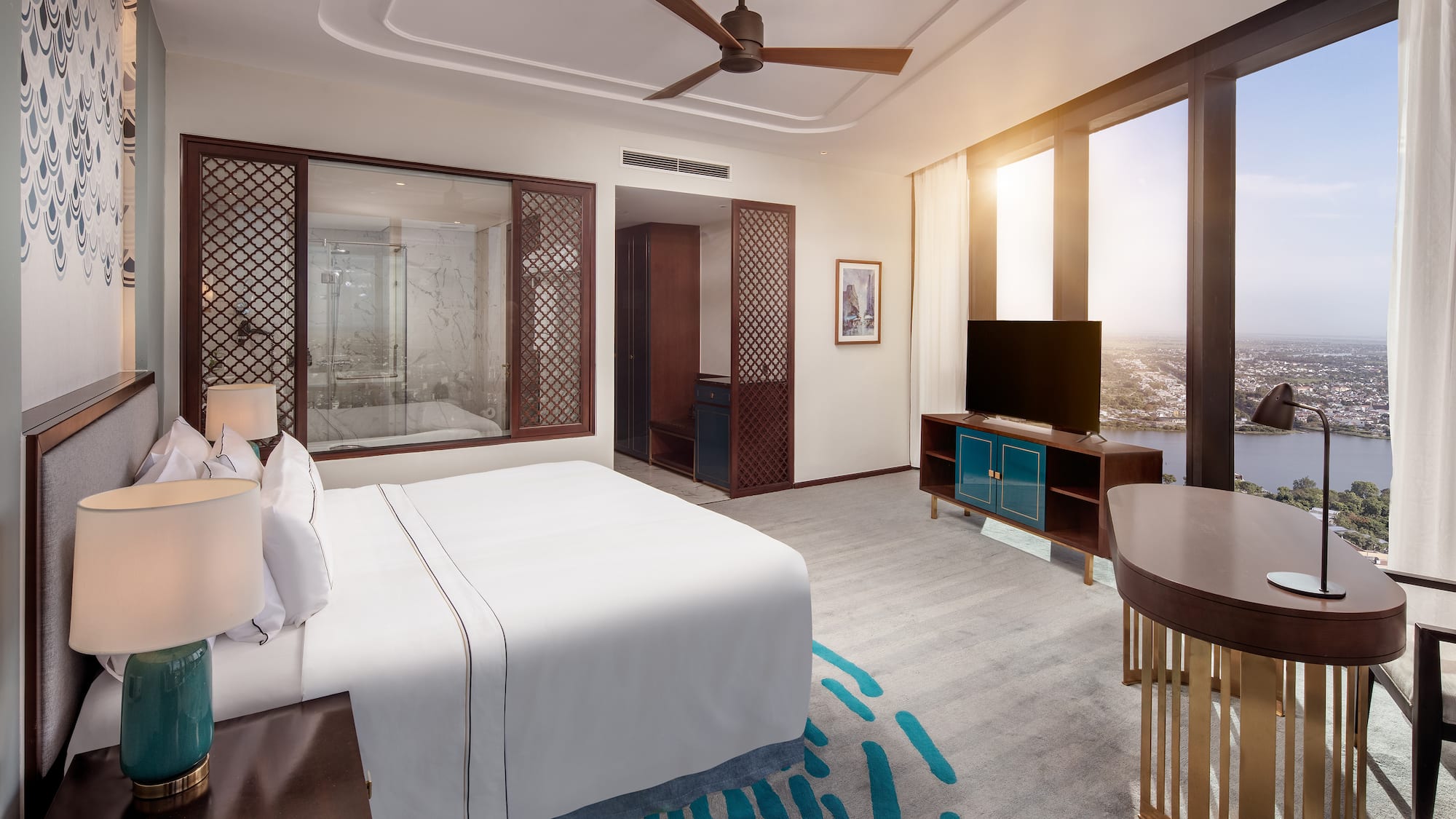 a room with a bed and a television