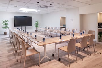 a room with a large table and chairs