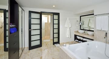 a bathroom with a bathtub and a tub