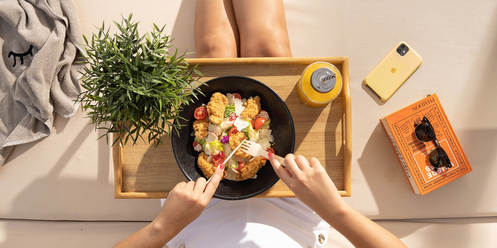 a person sitting on a tray eating food