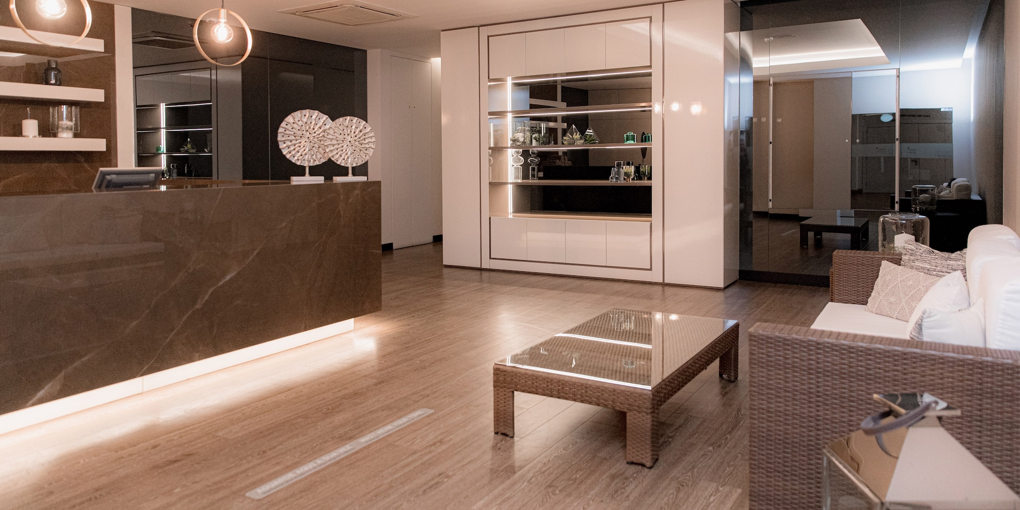 a room with a reception desk and chairs