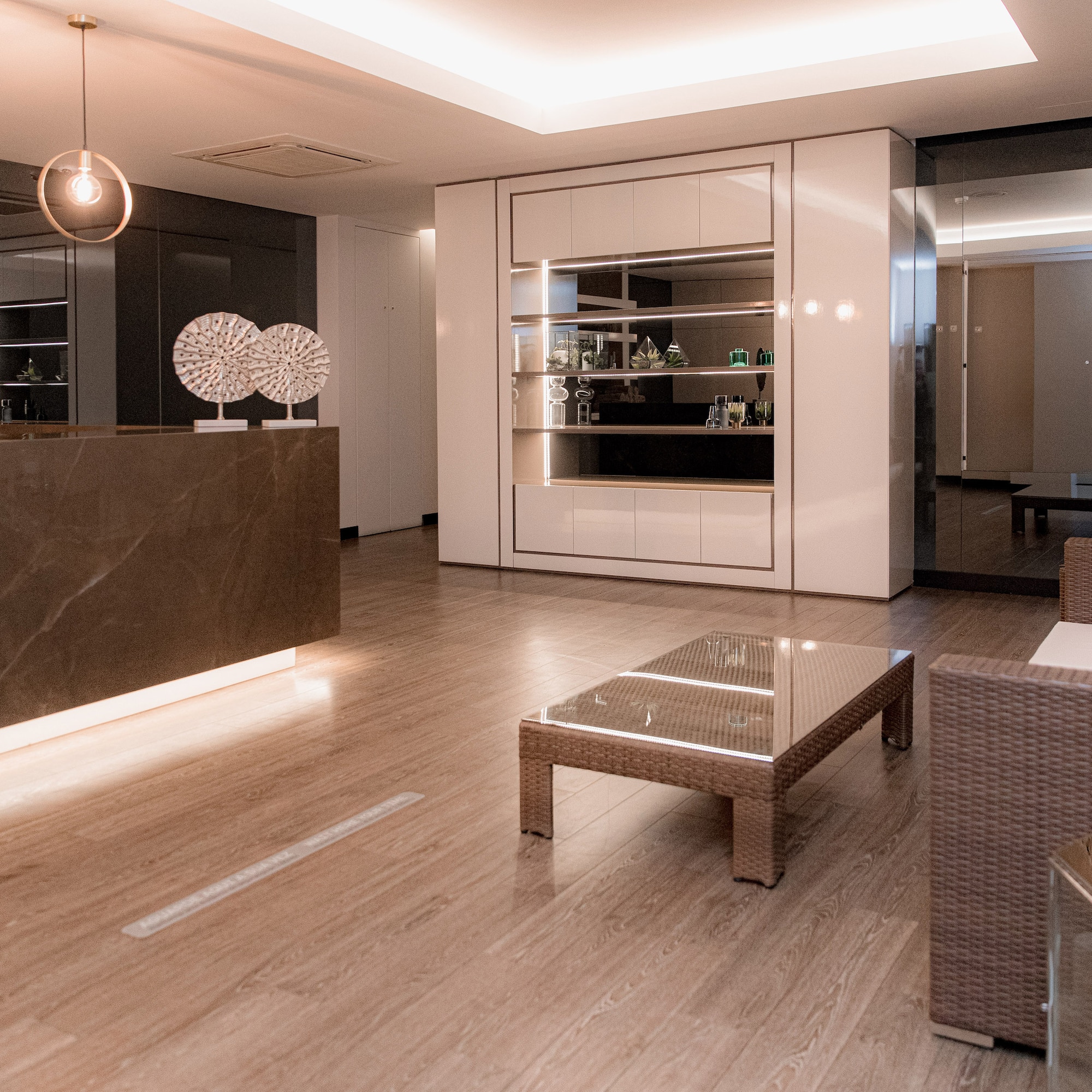 a room with a reception desk and chairs