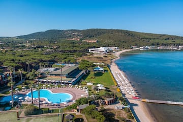 a swimming pool next to a body of water