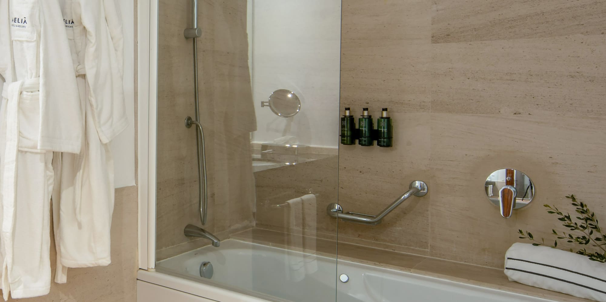 a bathtub and bathrobe in a bathroom