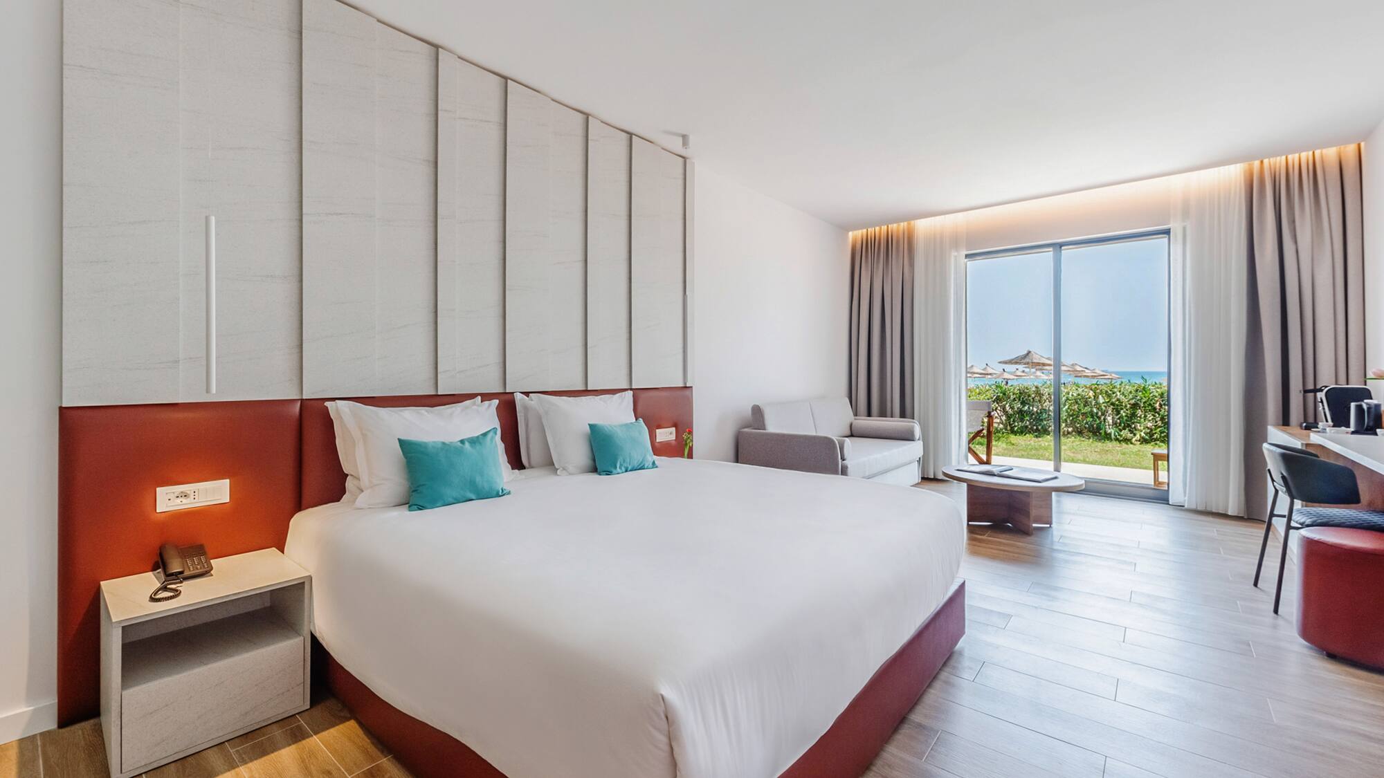 a bedroom with a large bed and a window