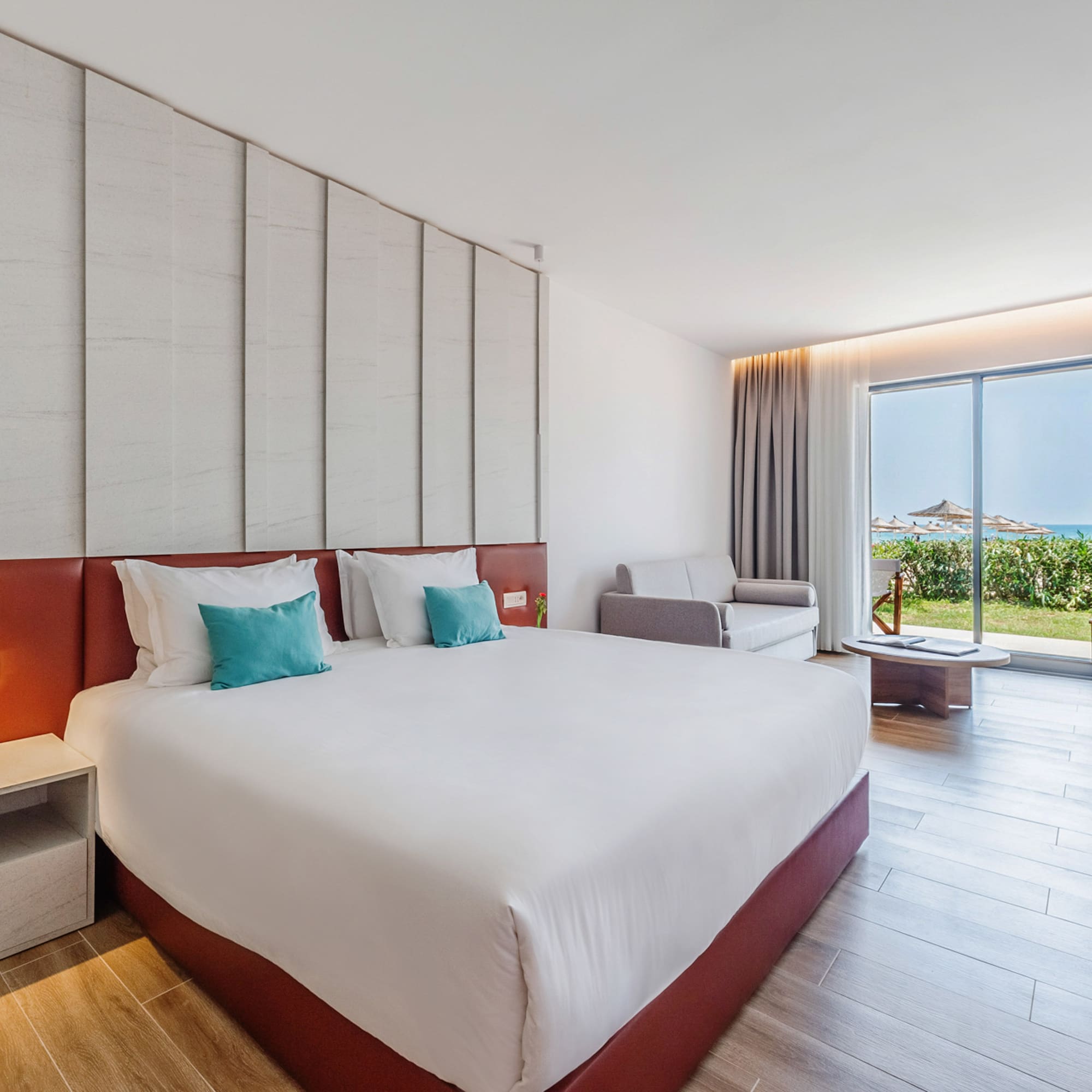 a bedroom with a large bed and a window