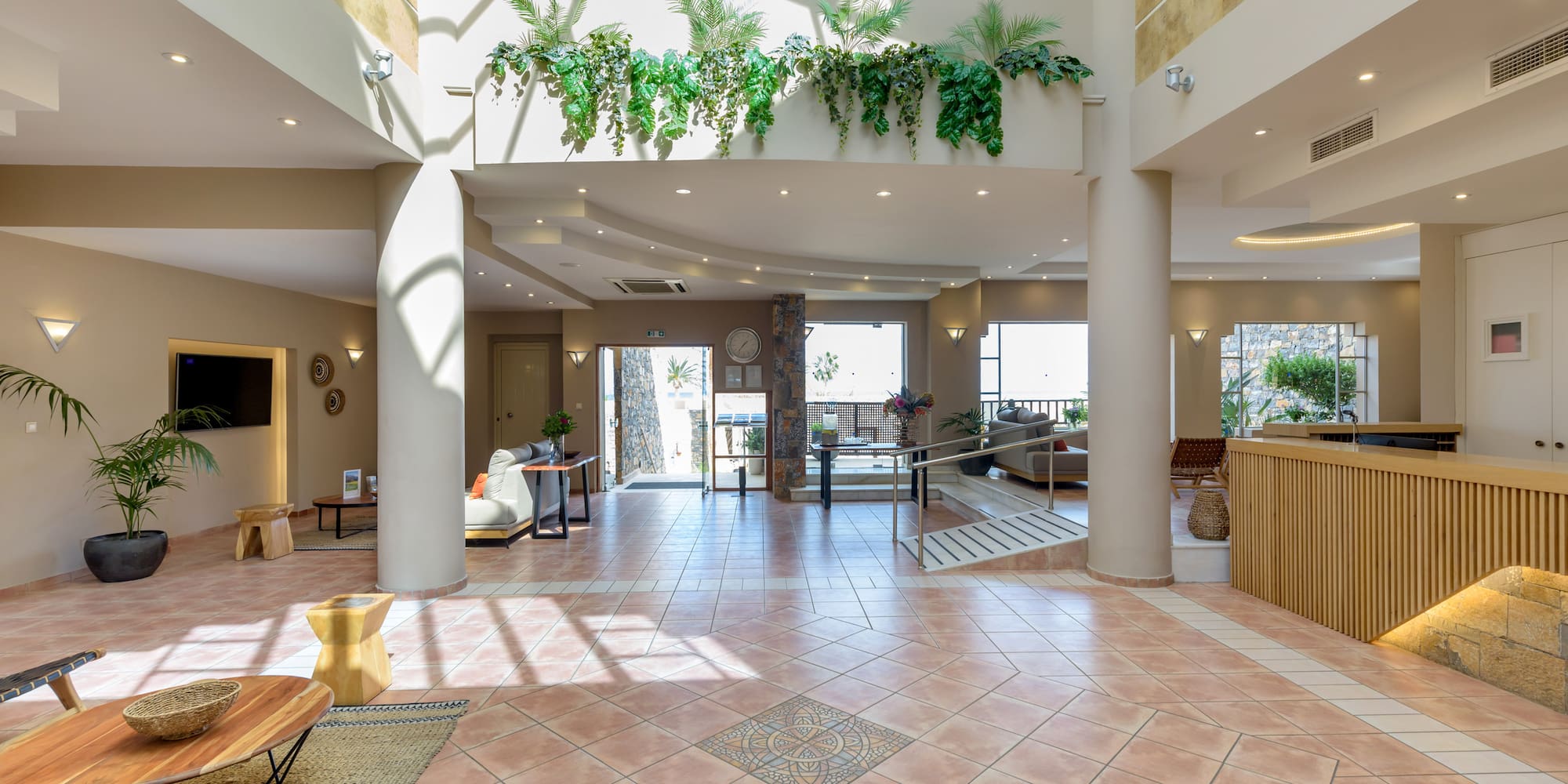 a large room with a large balcony and a large staircase