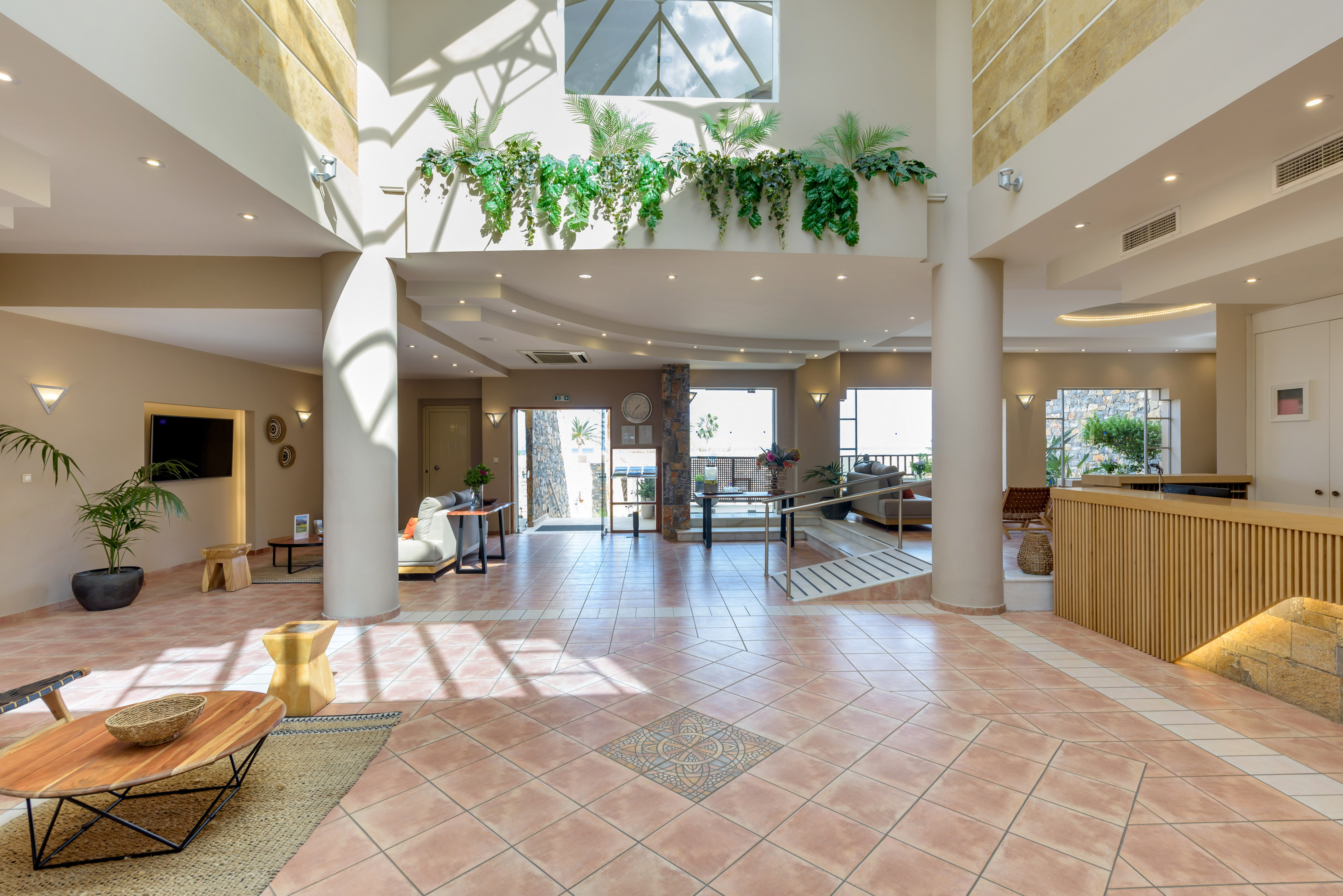 a large room with a large balcony and a large staircase