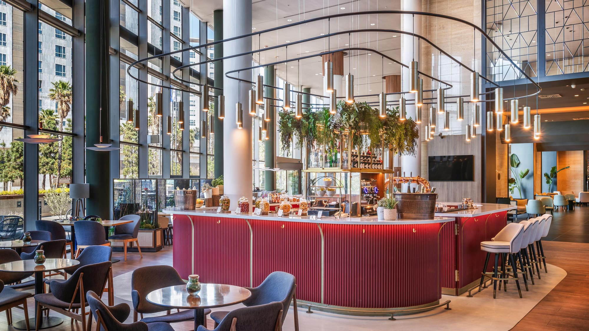 a restaurant with a bar and chairs