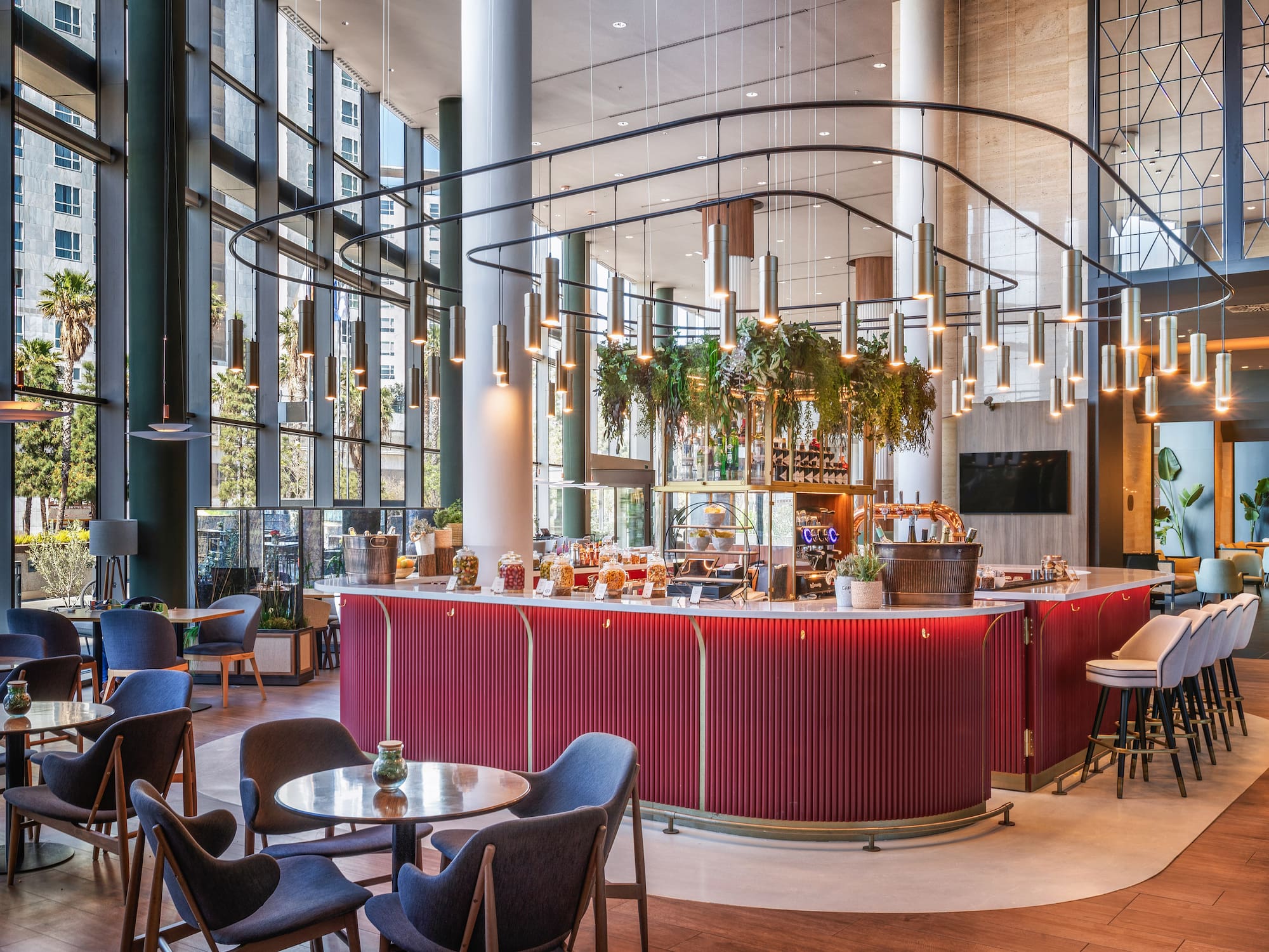 a restaurant with a bar and chairs