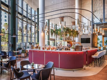 a restaurant with a bar and chairs