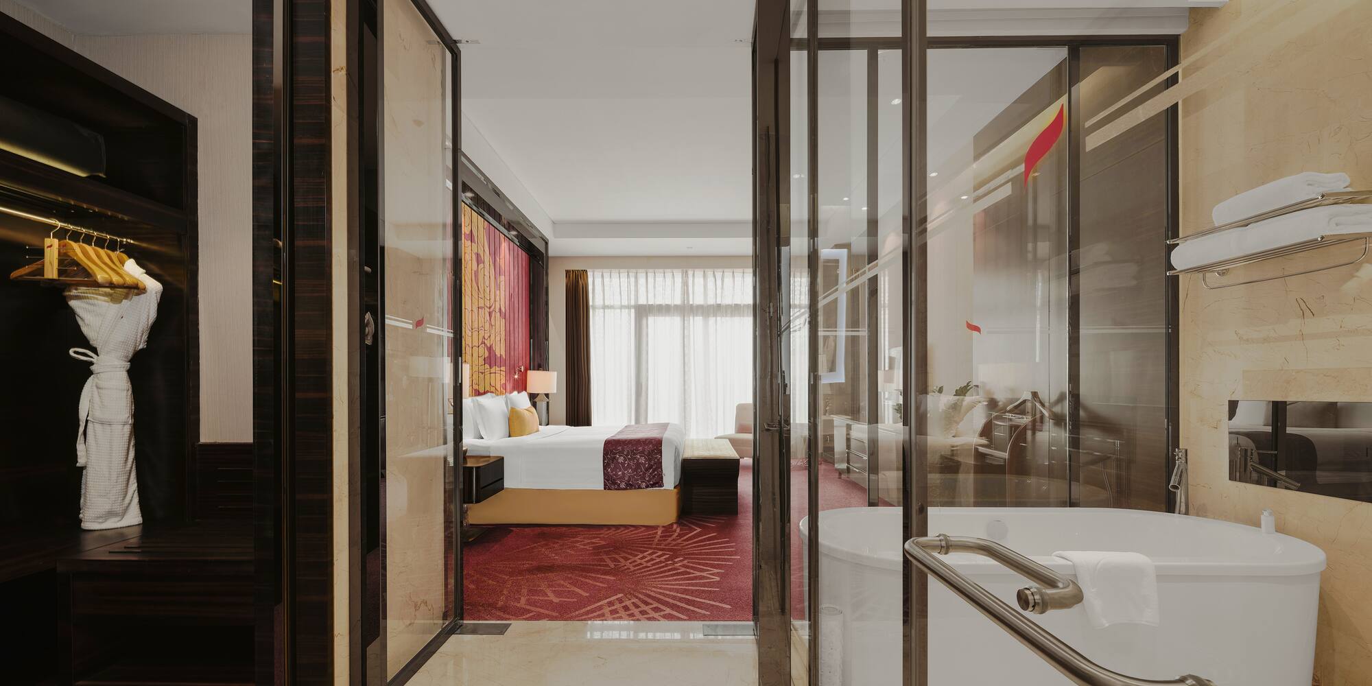 a bathroom with a tub and a bed