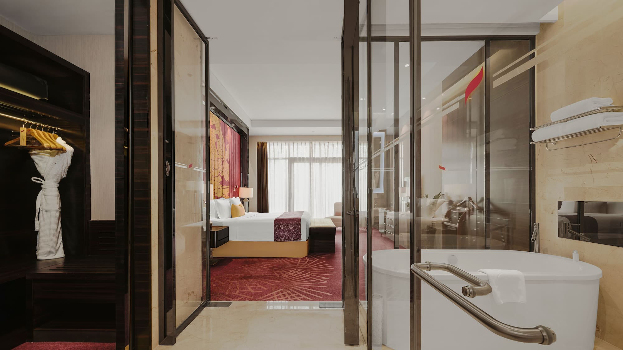 a bathroom with a tub and a bed