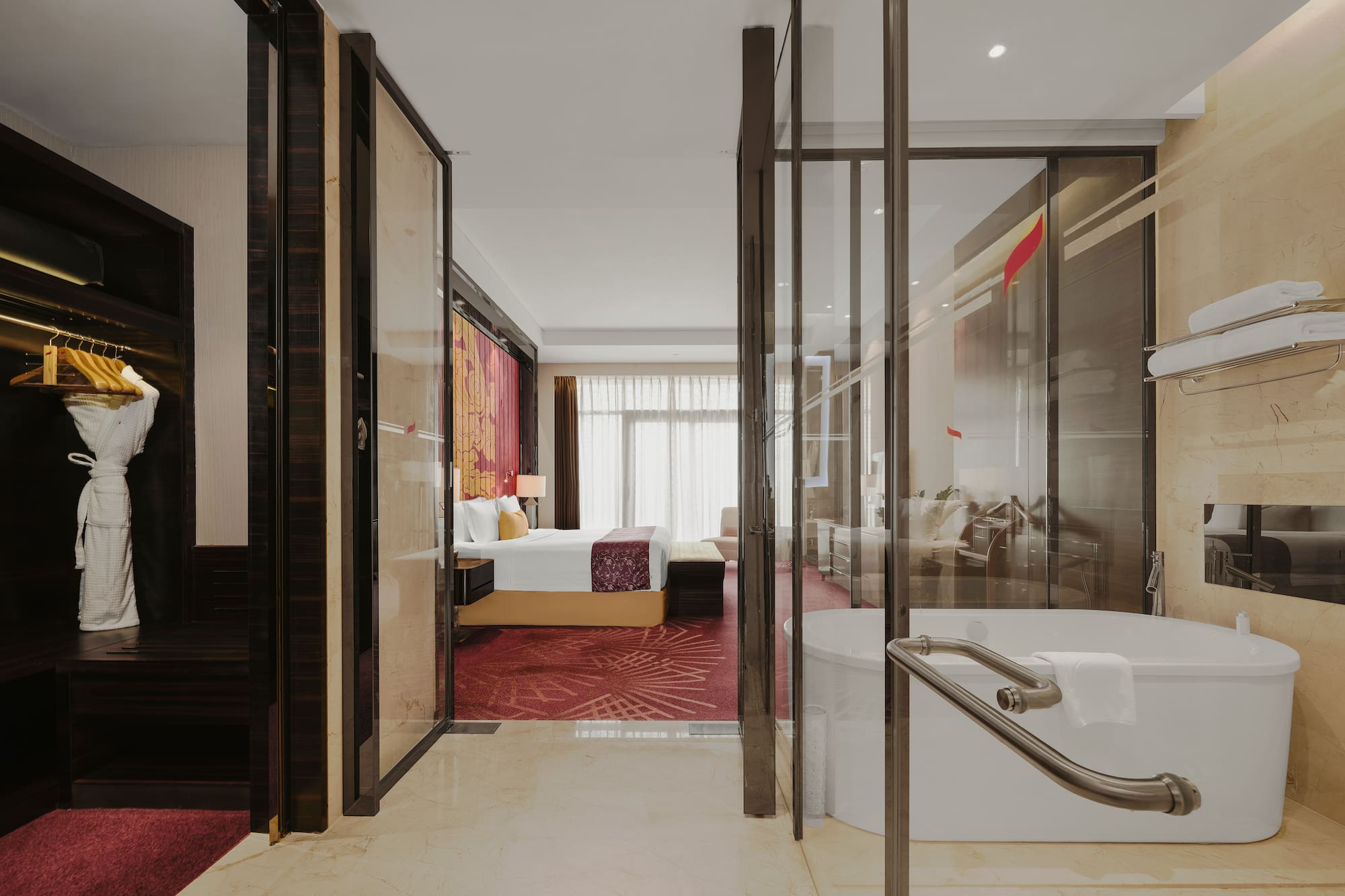 a bathroom with a tub and a bed