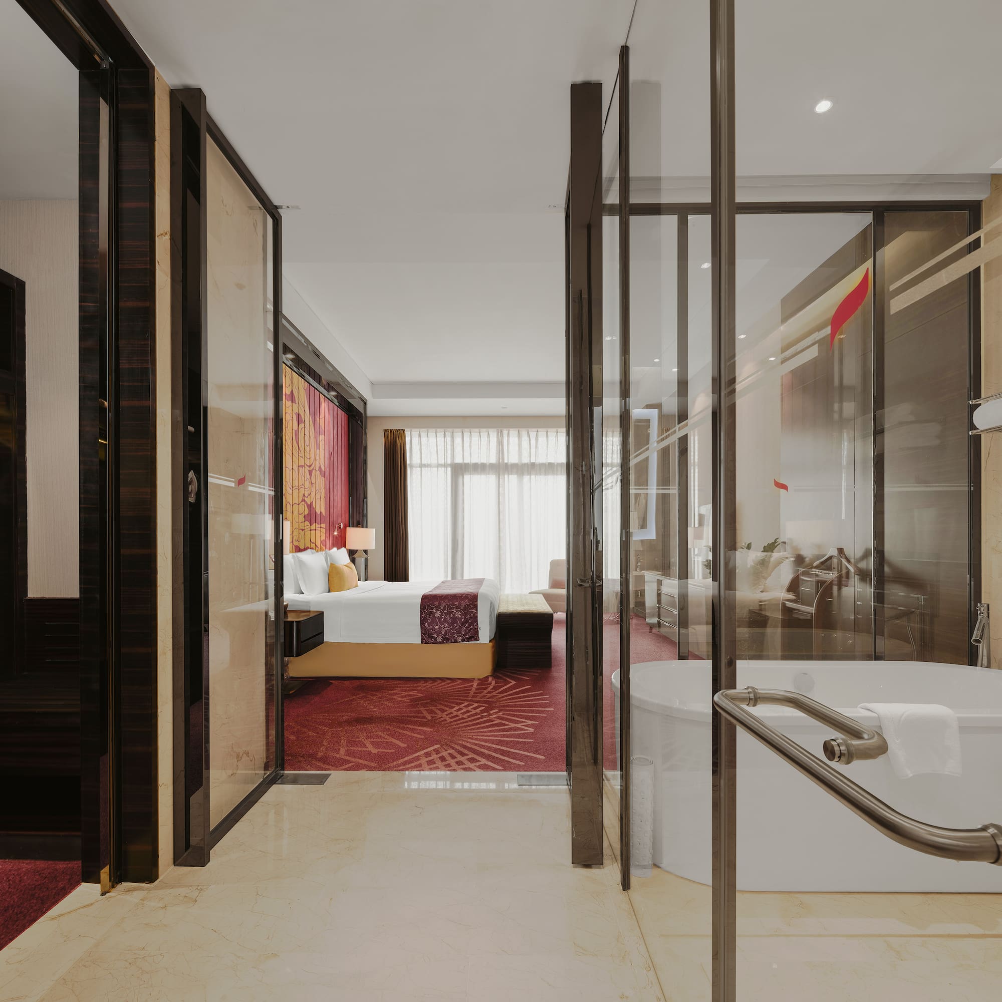 a bathroom with a tub and a bed