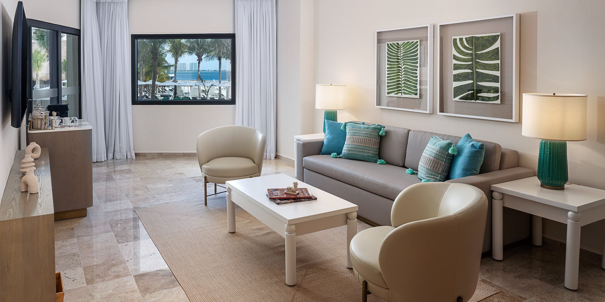 a living room with a couch and chairs