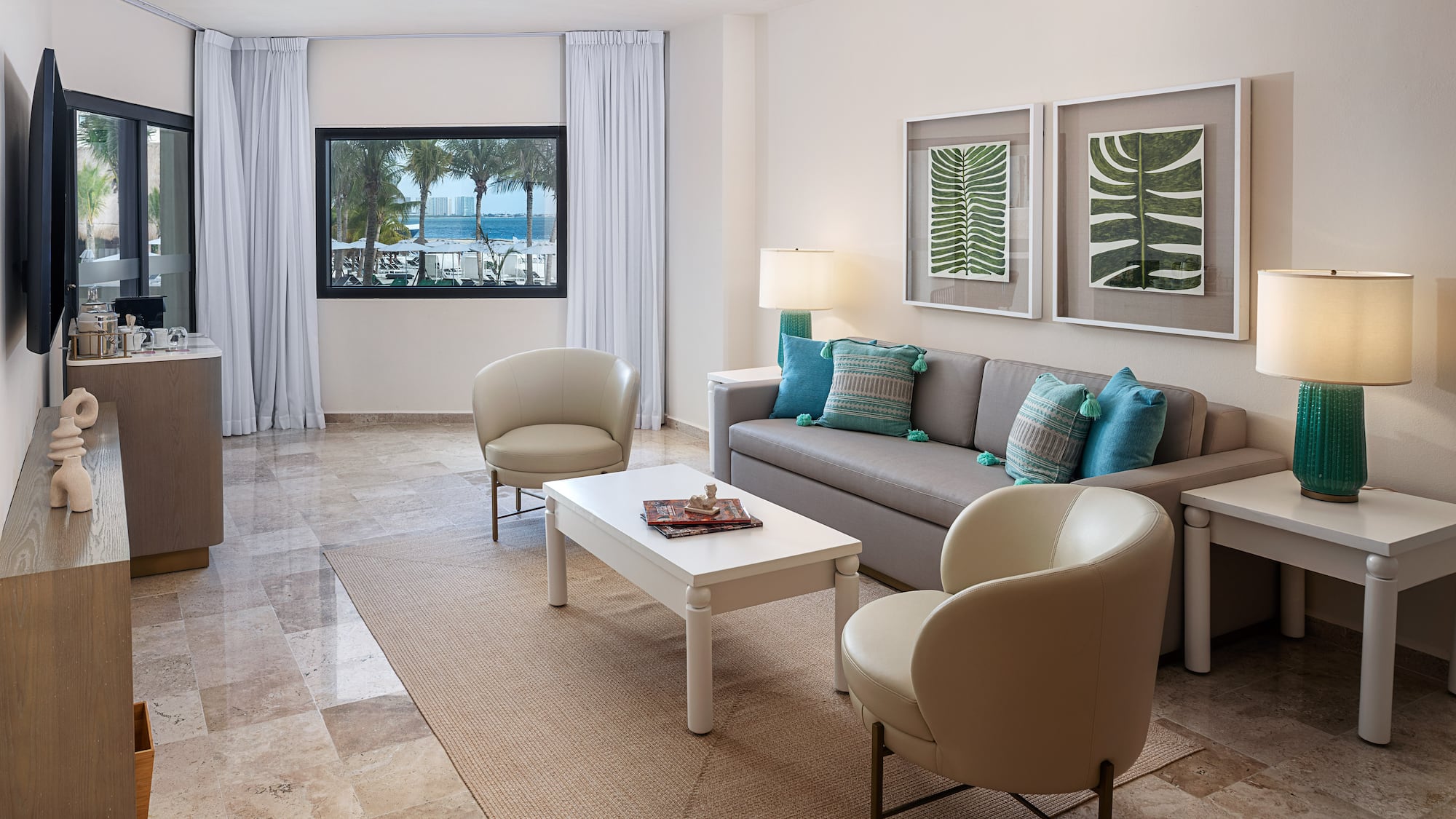 a living room with a couch and chairs