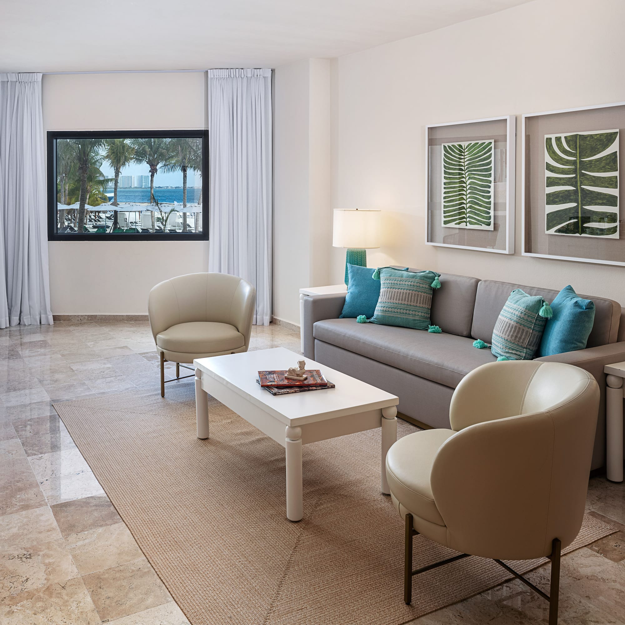 a living room with a couch and chairs