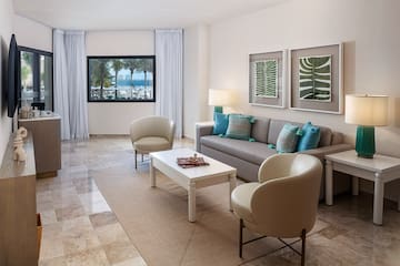a living room with a couch and chairs