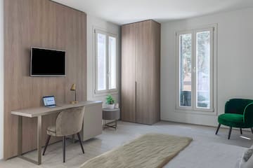 a room with a desk and a computer