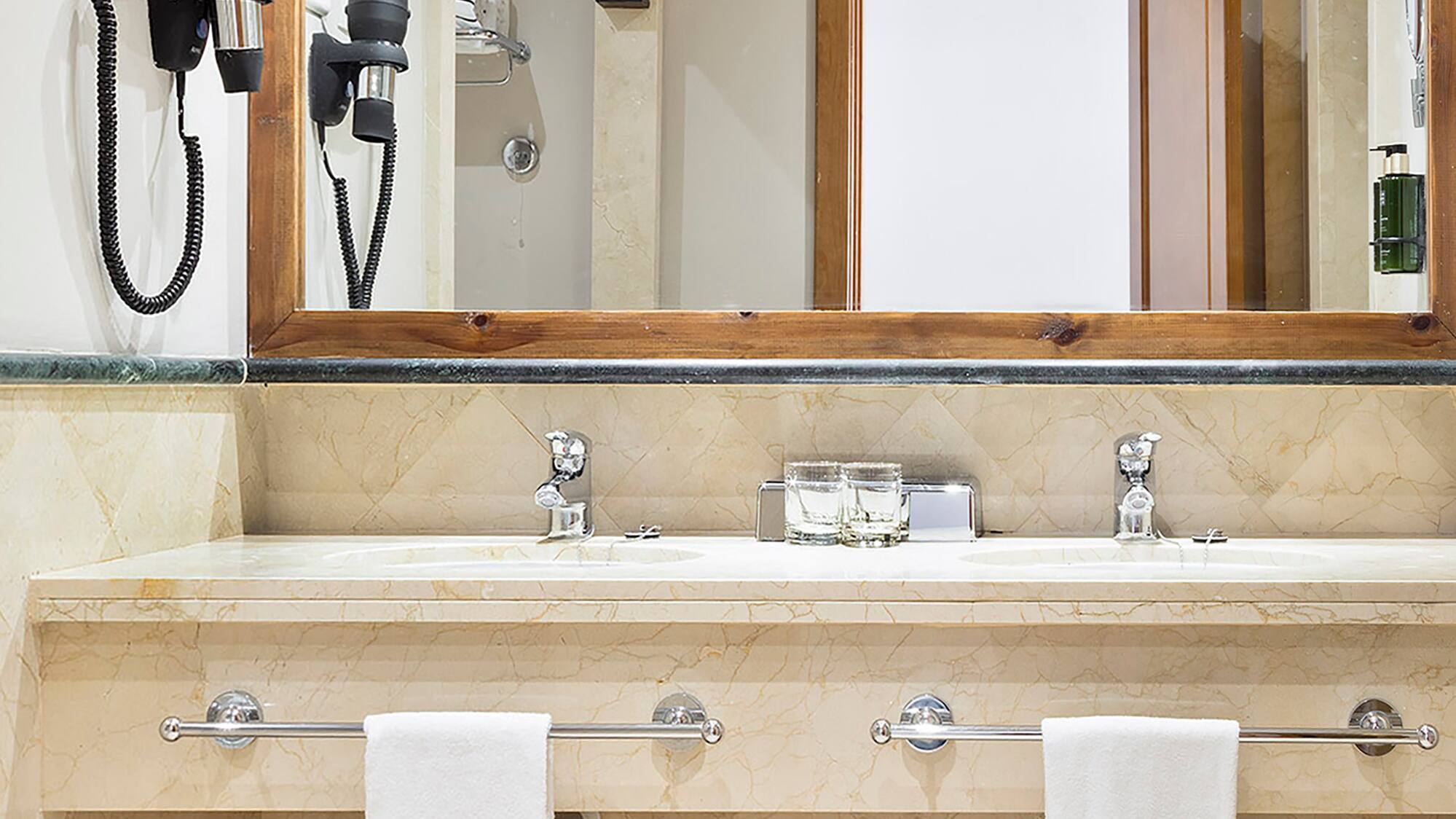 a bathroom with a mirror and a sink