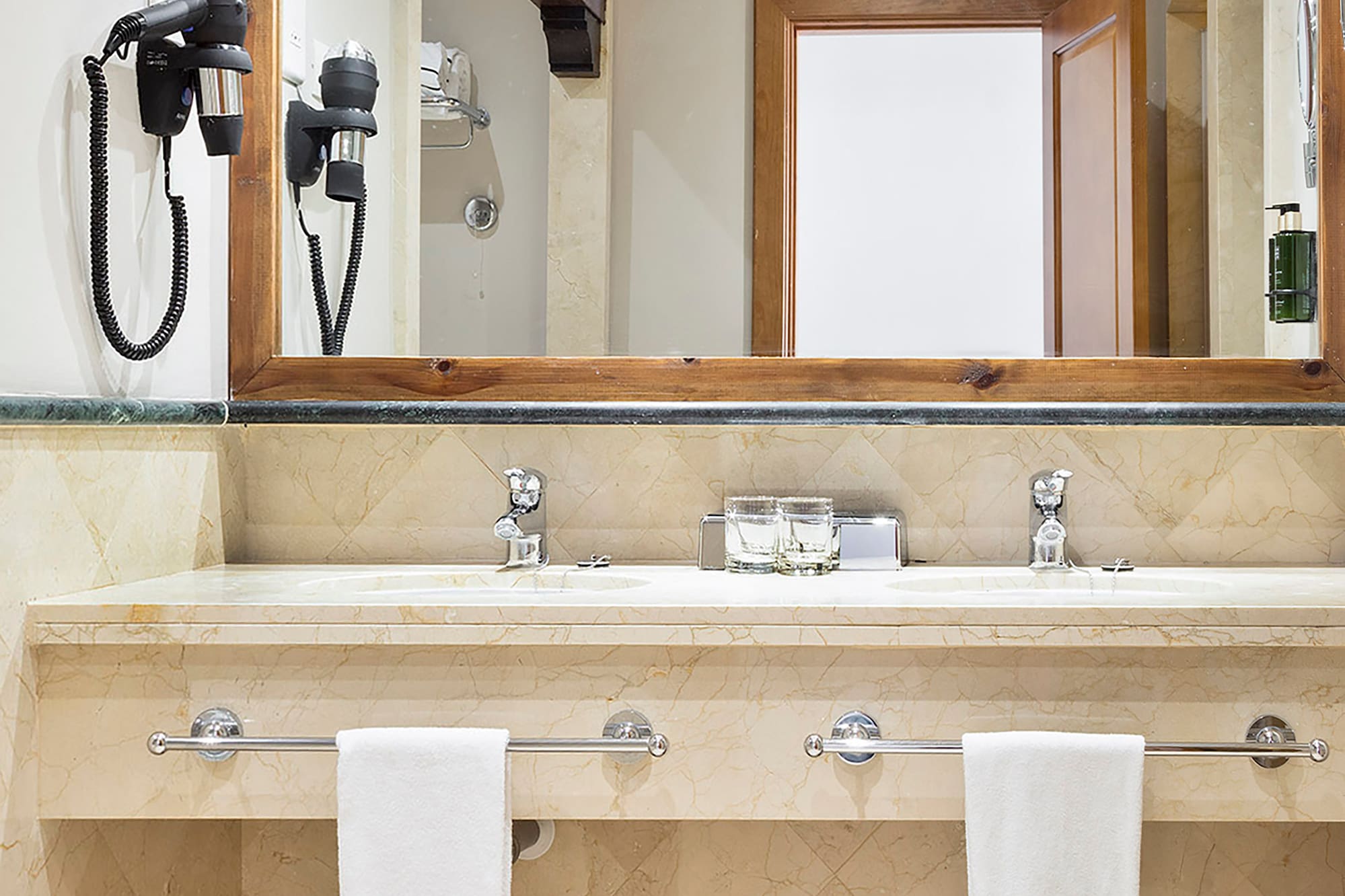a bathroom with a mirror and a sink