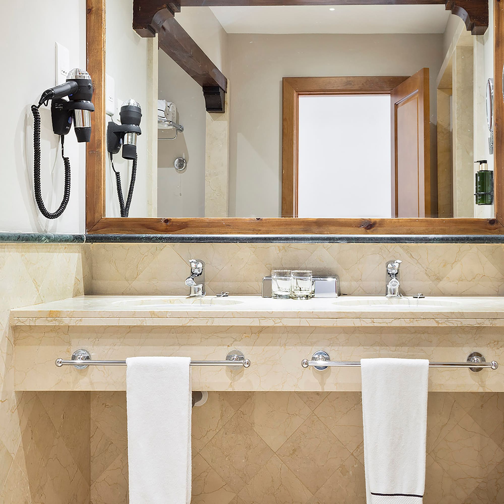 a bathroom with a mirror and a sink