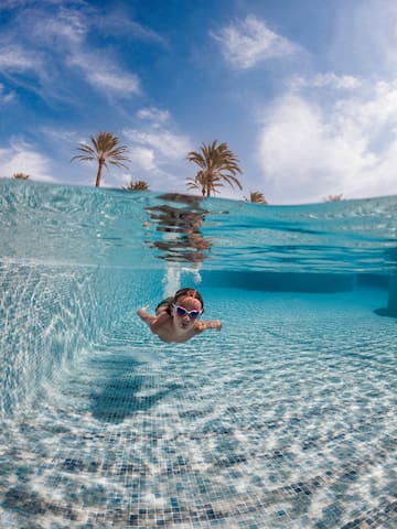 a person swimming in a pool